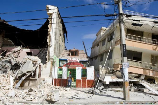 A man exits a restaurant after he looked for his belongings. An earthquake rocked Port au Prince on January 12. Photo Marco Dormino
